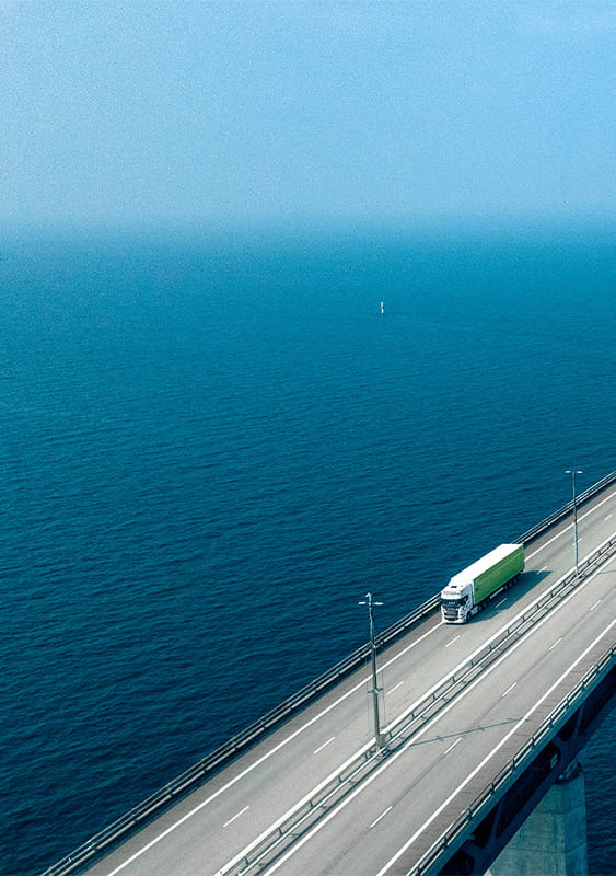 long bridge road concrete truck ocean sea water international trade economy business ICAEW