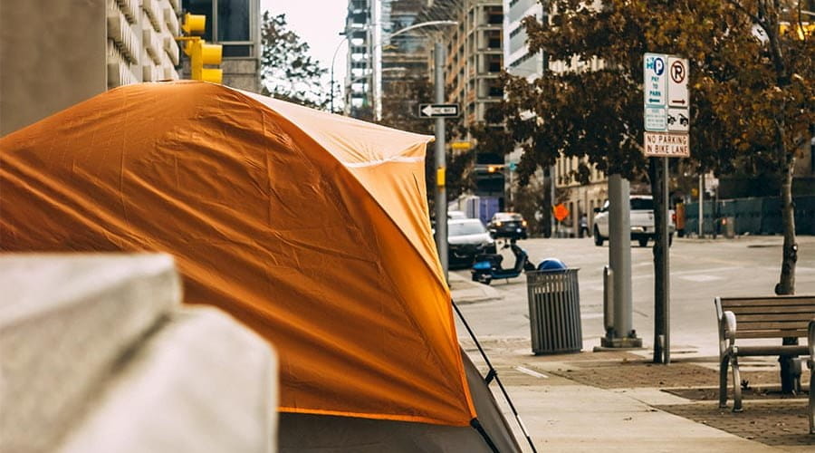A tent pitched on a city pavement