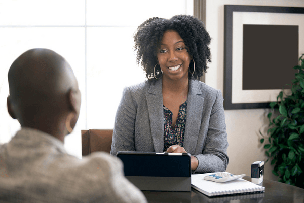 Business woman talking to client in her office
