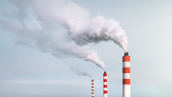 smoke fumes pollution chimney stacks red white carbon sky