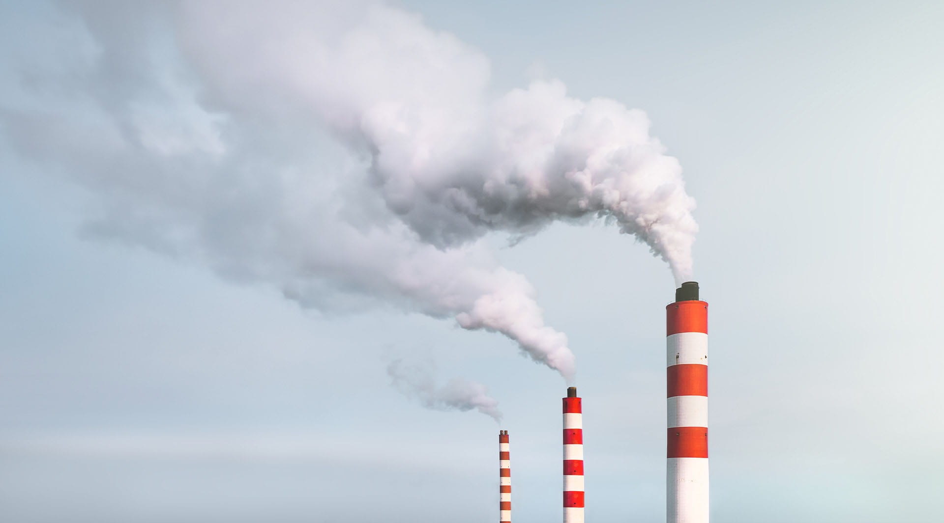 smoke fumes pollution chimney stacks red white carbon sky