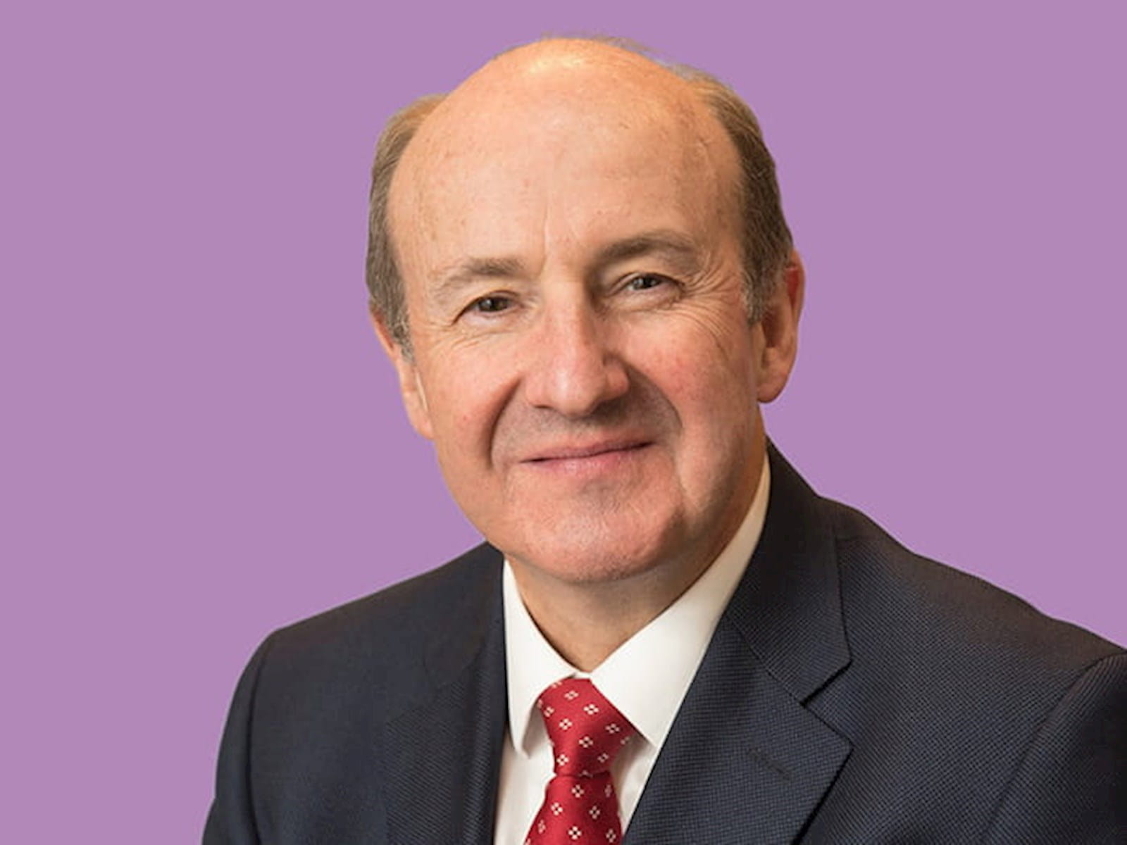 Michael Izza ICAEW CEO Chief Executive man suit tie purple background