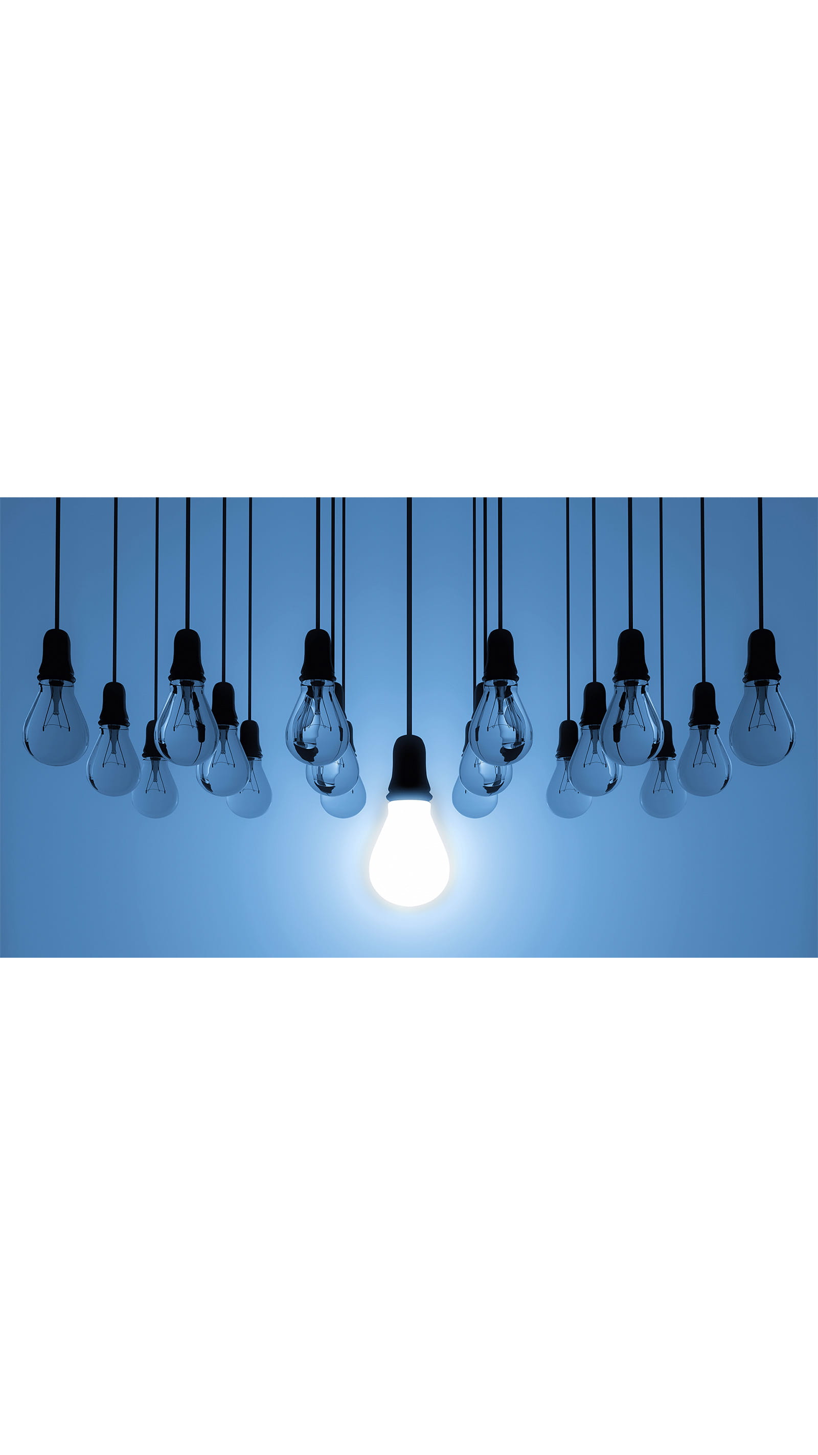 light bulbs glow hanging black cables blue background