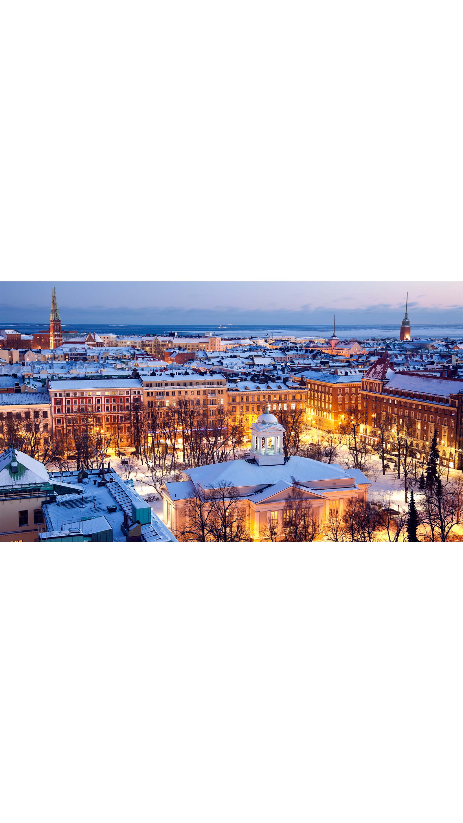 Helsinki Finland city skyline snow evening night lights winter tax conference
