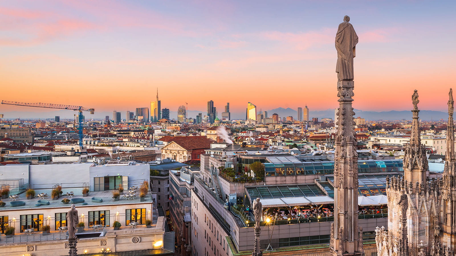 Milan Italy city skyline cathedral catholic sunset orange sky buildings