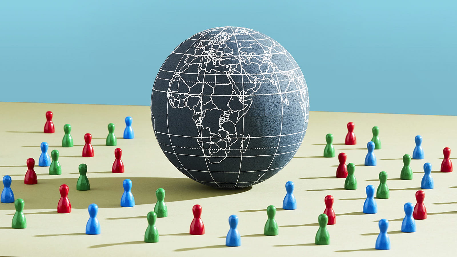 digital 3D illustration of the globe Earth on a desk surrounded by green blue red pegs