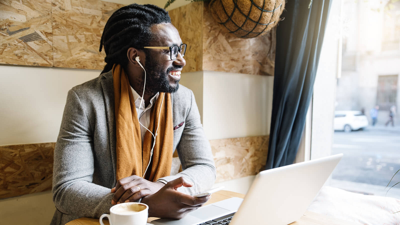 Businessman using his laptop in a coffee shop