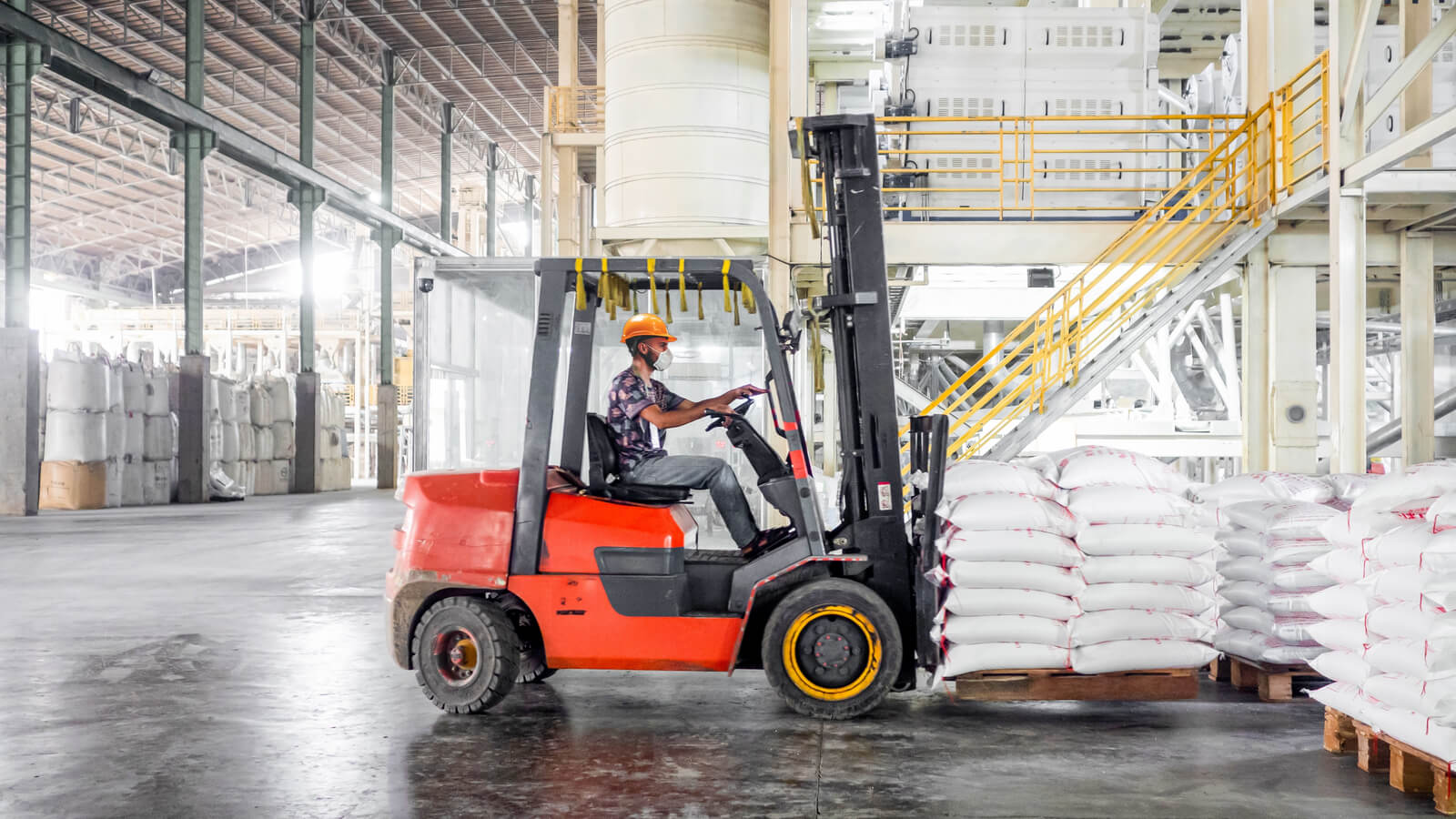 Fork lift truck in warehouse
