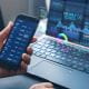 Business person analysing financial data on virtual screen.