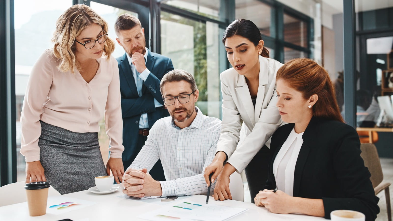 Five people in a meeting