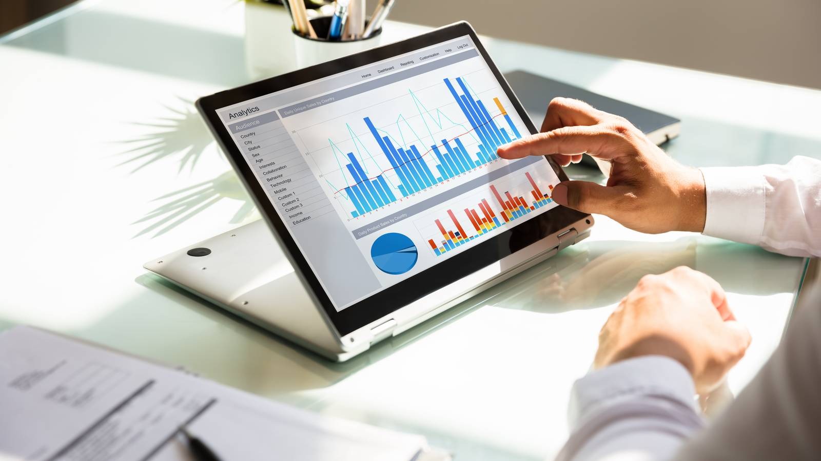 Person looking at data on laptop