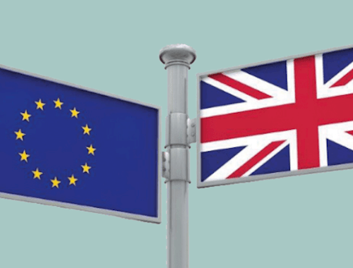 A signpost with an EU flag on one side and a Union Jack on another, pointing in different directions.