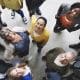 Diverse group of people smiling and looking up