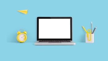 Computer with clock and stationary beside it