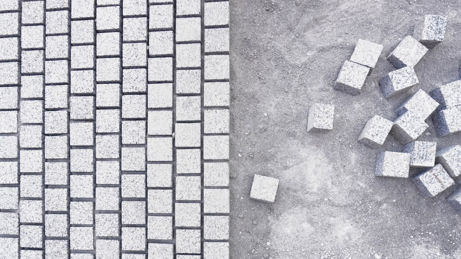 Concrete blocks, some scattered and some in rows
